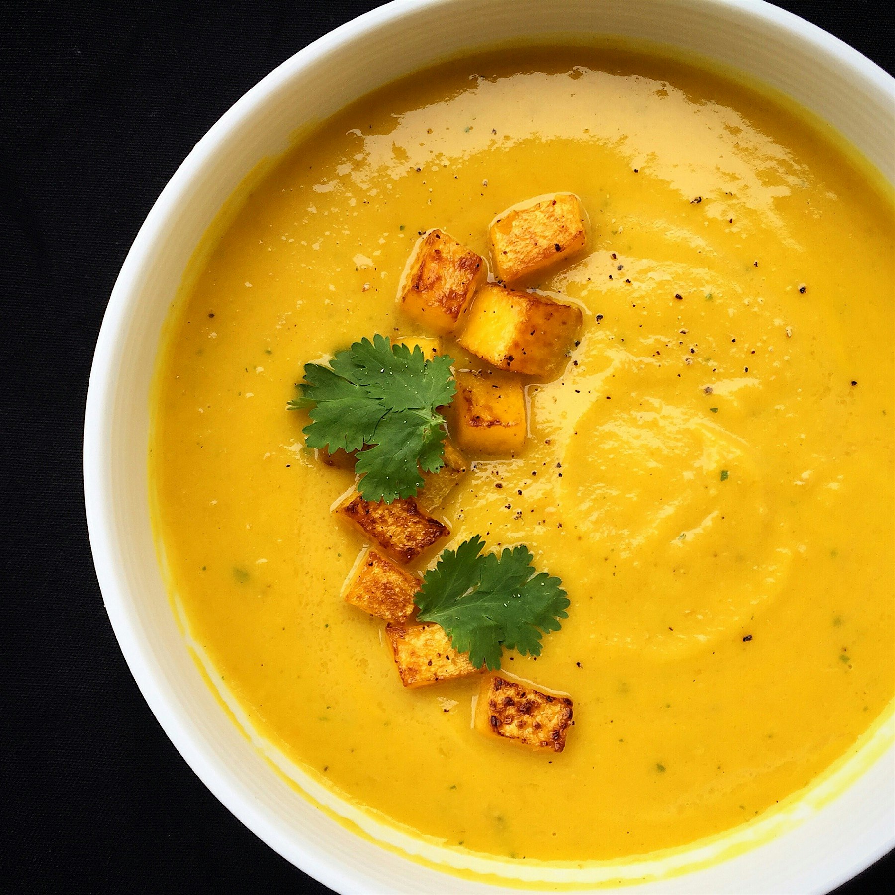 Butternut squash and turmeric coconut soup. The addition of fresh coriander add another layer of ...