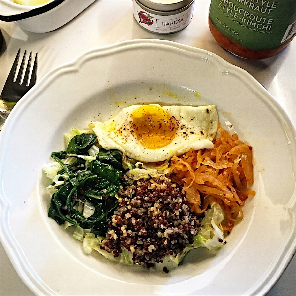 Starting the day savoury. Sautéed spinach and Chinese lettuce, quinoa, kimchi and Harissa dusted ...
