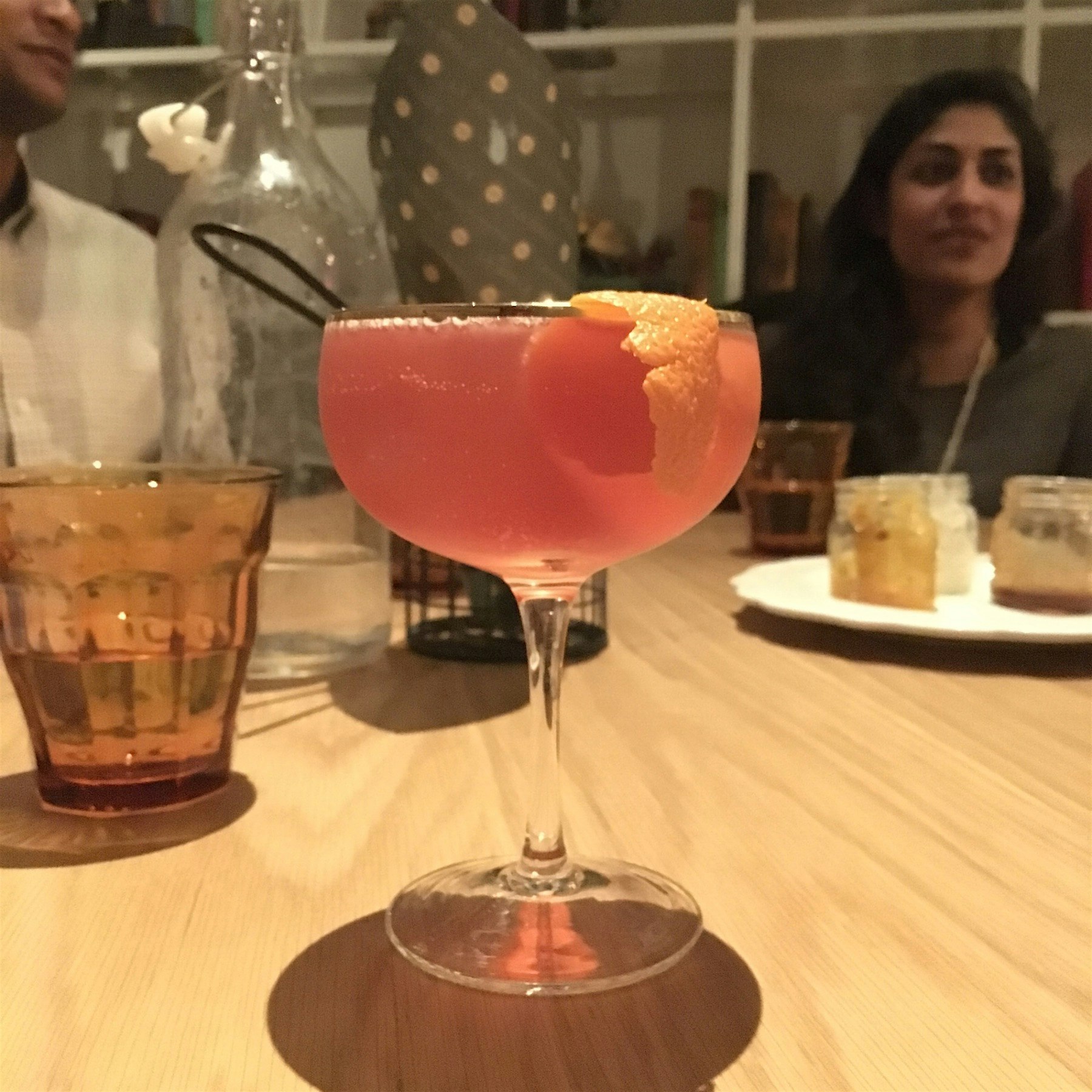 A delicious spin in a French 75 with Grapefruit. Photo bomb by fresh churros. Mmmmmm 