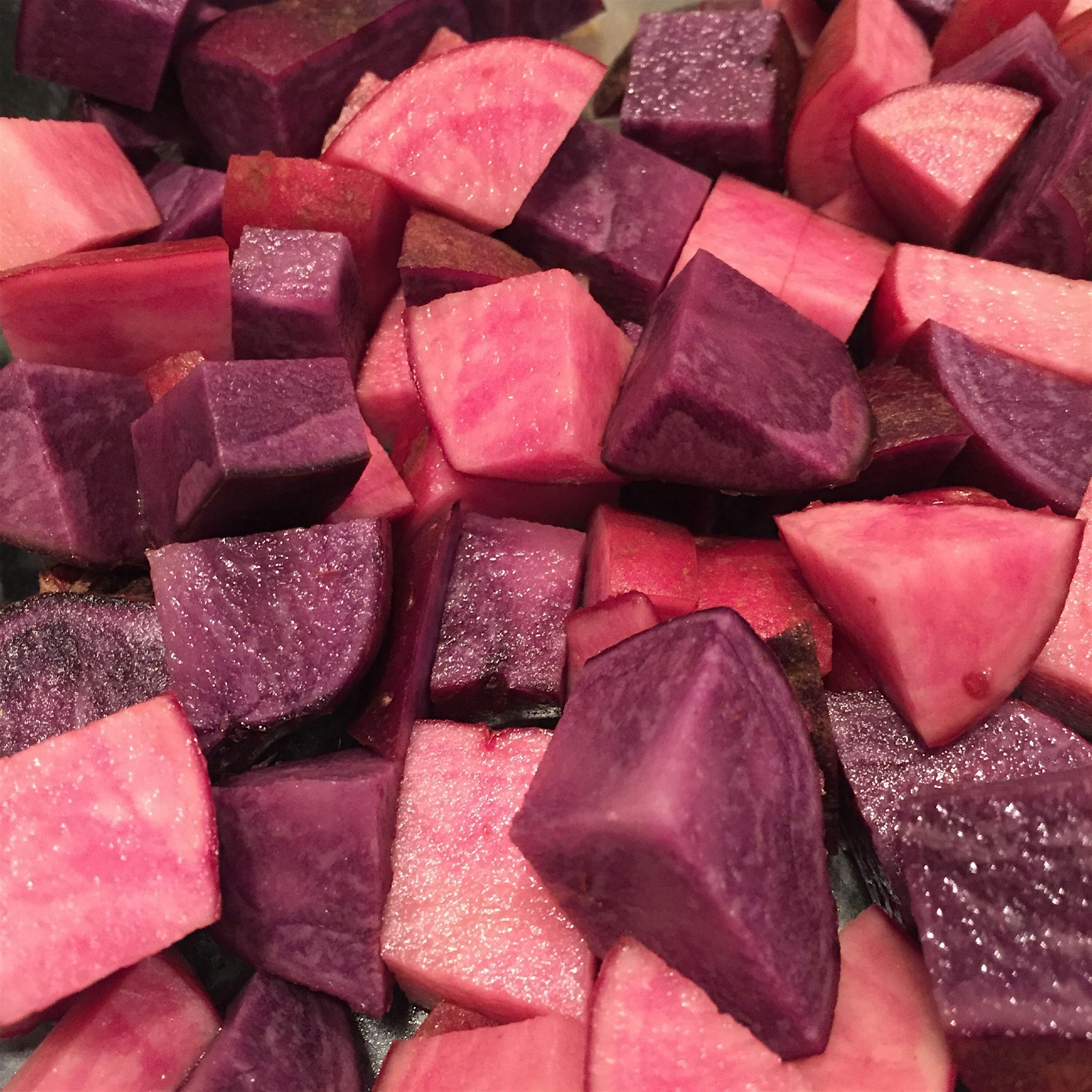 Pink and purple potatoes getting ready to be roasted! Local sustainable ag products are so beauti...
