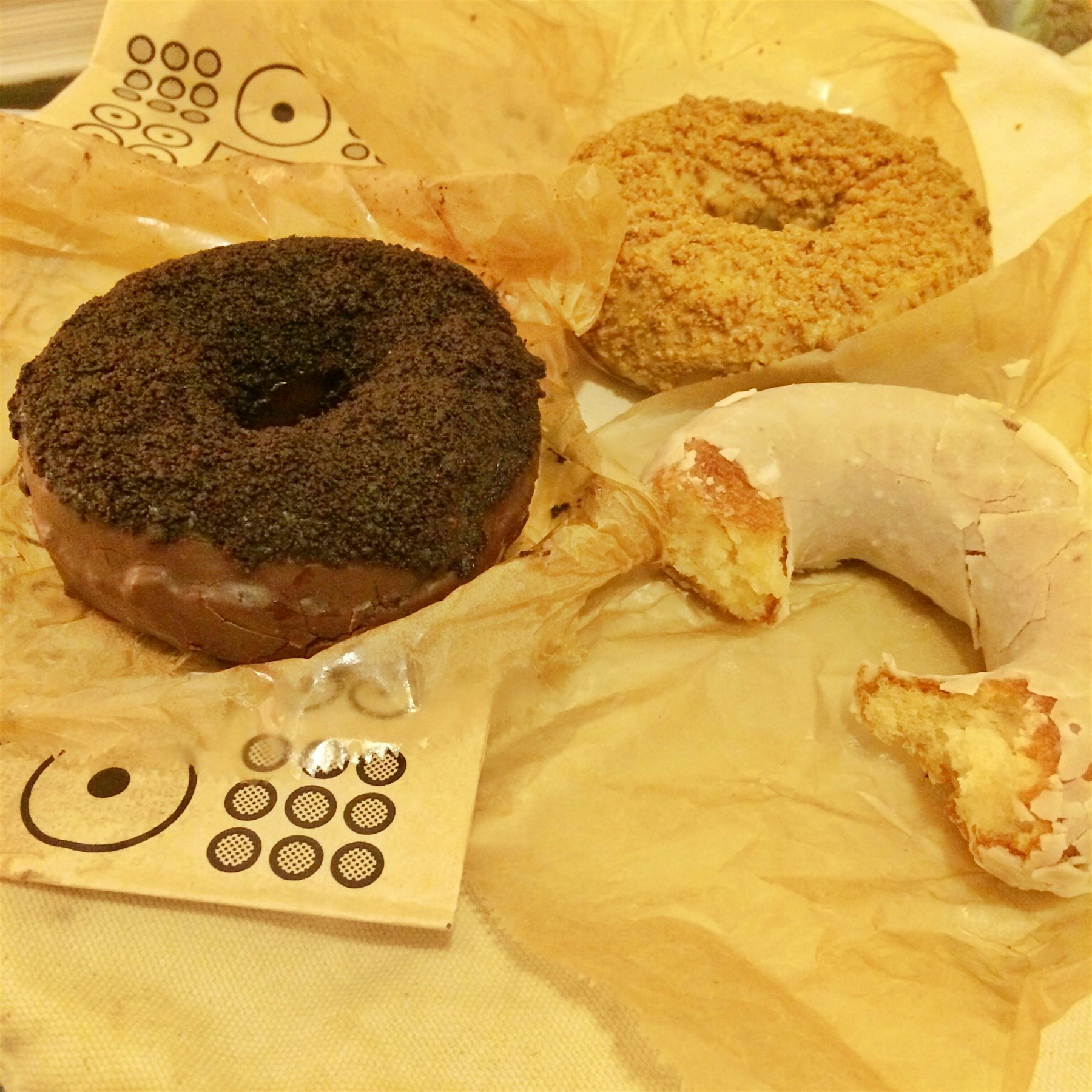 The Holey Trinity of Doughnut Plant Blackout, Coffee Cake, and Dulce de Leche cake doughnuts. 