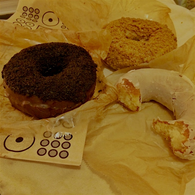 The Holey Trinity of Doughnut Plant Blackout, Coffee Cake, and Dulce de Leche cake doughnuts. 