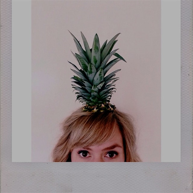 Playing with my food. In addition to being the most stylish hat, you can plant the top of a pinea...