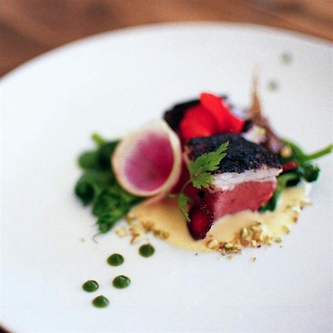 Here is a leek-ash crusted #sousvide lamb saddle with grilled corn purée, chrysanthemum fluid gel...