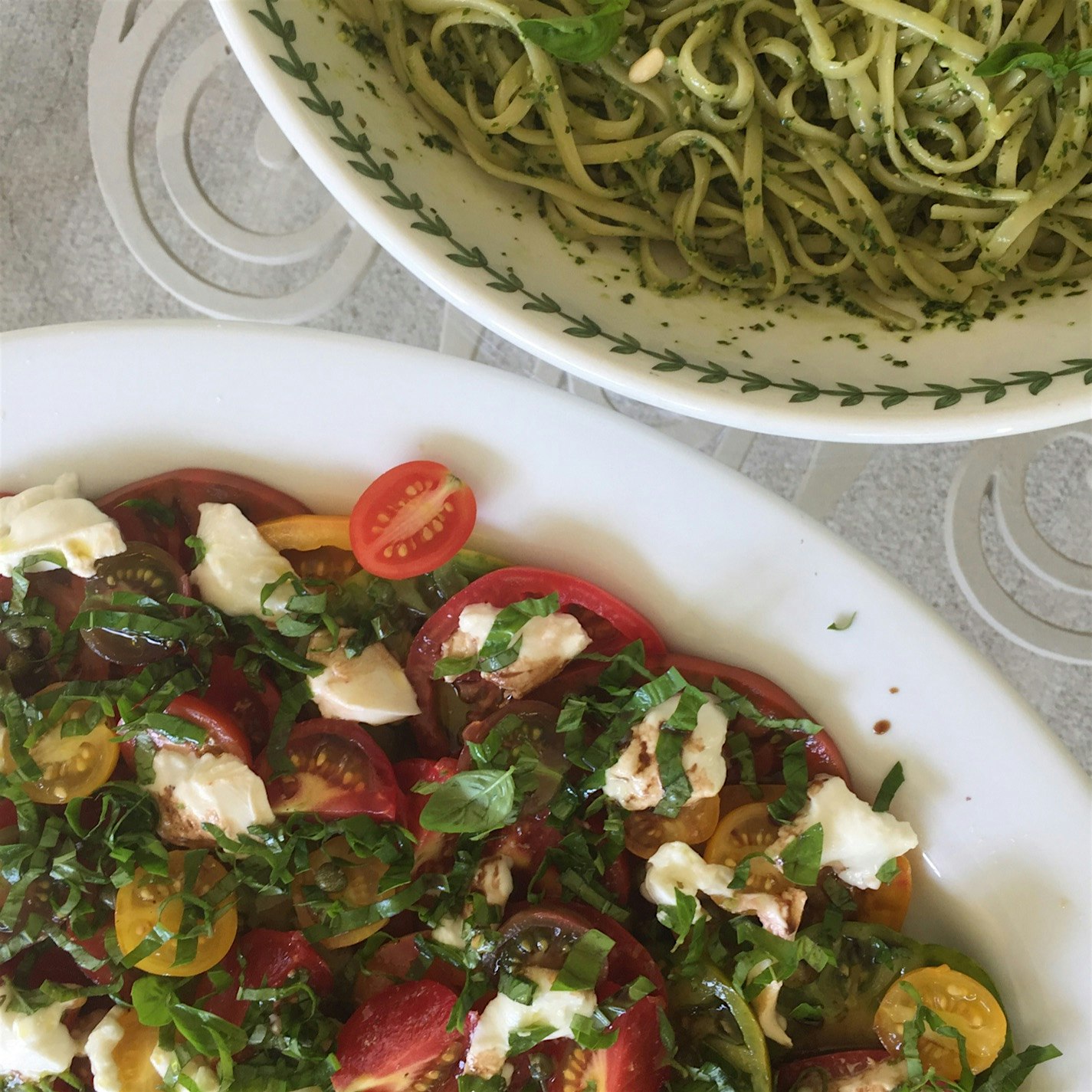 Nothing screams summer like a caprese salad fresh from the garden. Served alongside homemade pesto.